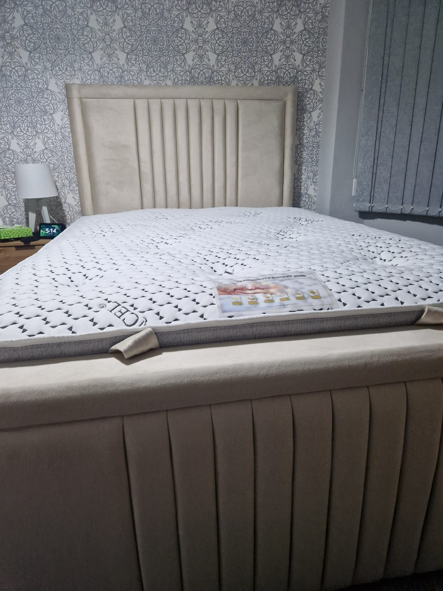 Luxury SleepandBeds bumper ottoman divan bed with upholstered headboard and storage drawers in a modern bedroom setting.
