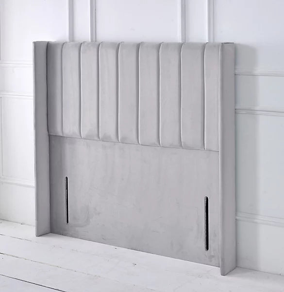 Handmade UK SleepandBeds wing panel bed headboard with clean lines and soft fabric upholstery on a wooden frame.