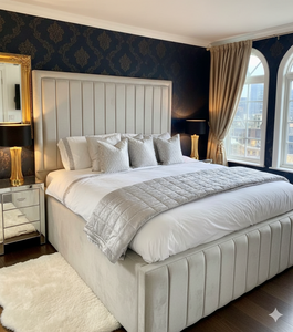 Charcoal gray upholstered bed frame from SleepandBeds, featuring a padded headboard and modern design for a stylish bedroom.